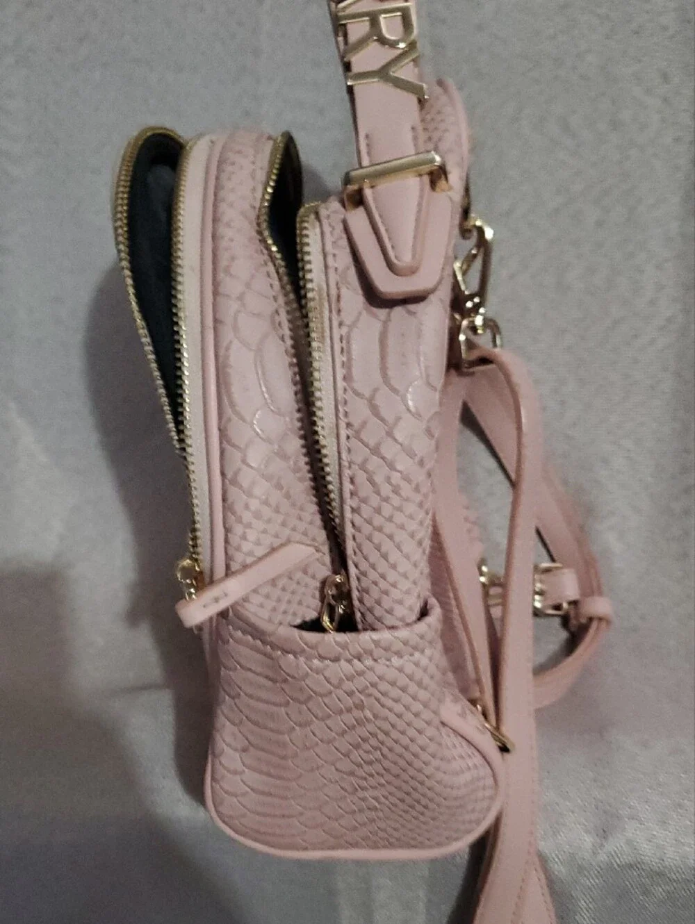 Tote & Carry Pink Textured Mini Backpack with Gold Accents